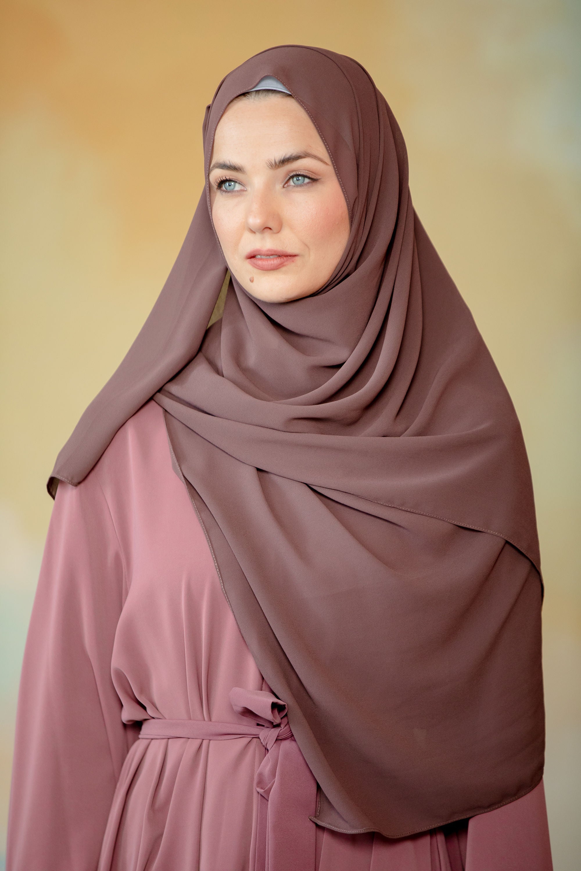 Dark brown chiffon hijab on woman in modest dress