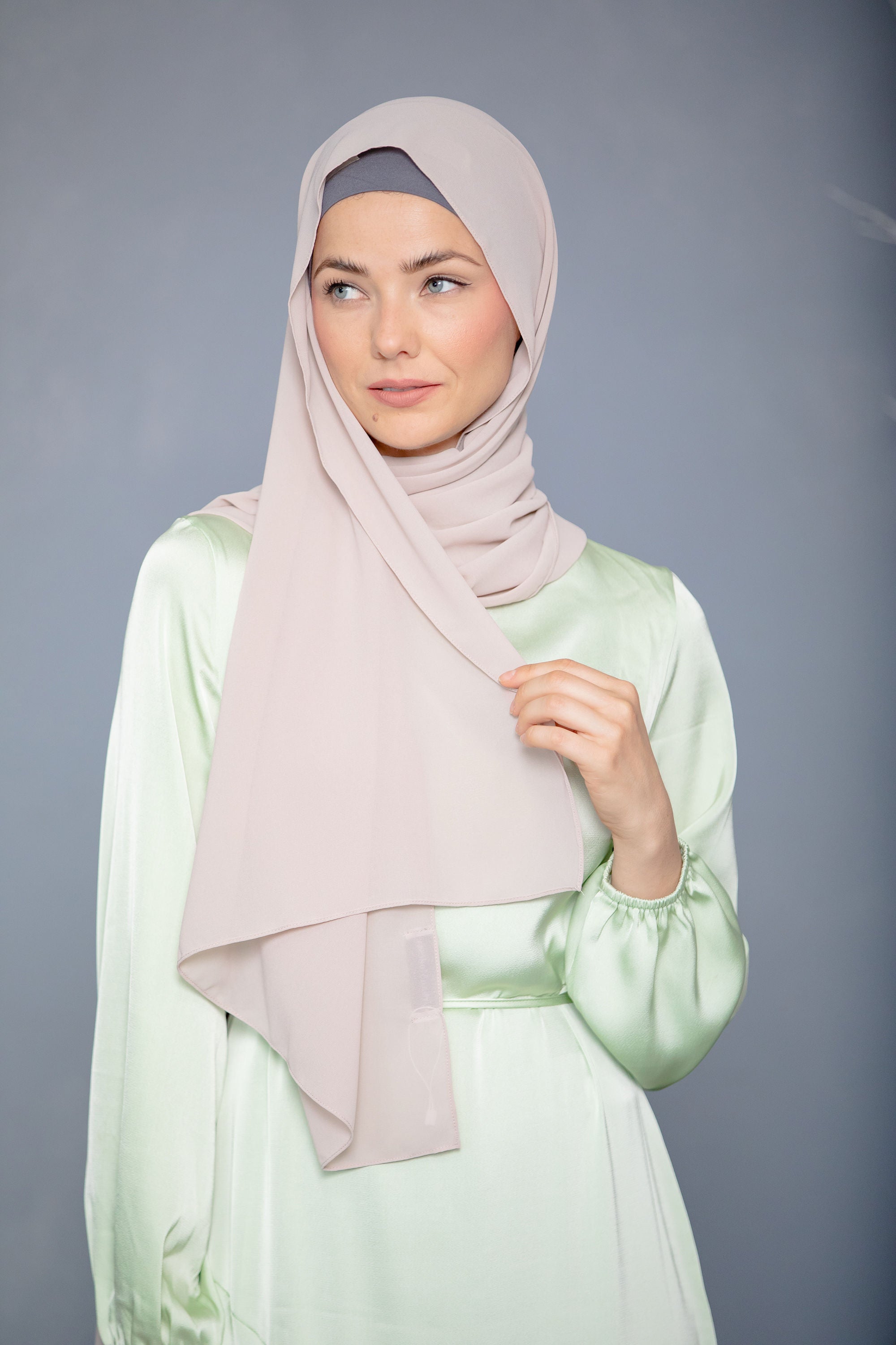 Woman in hijab and satin dress for Latte Chiffon Hijab product