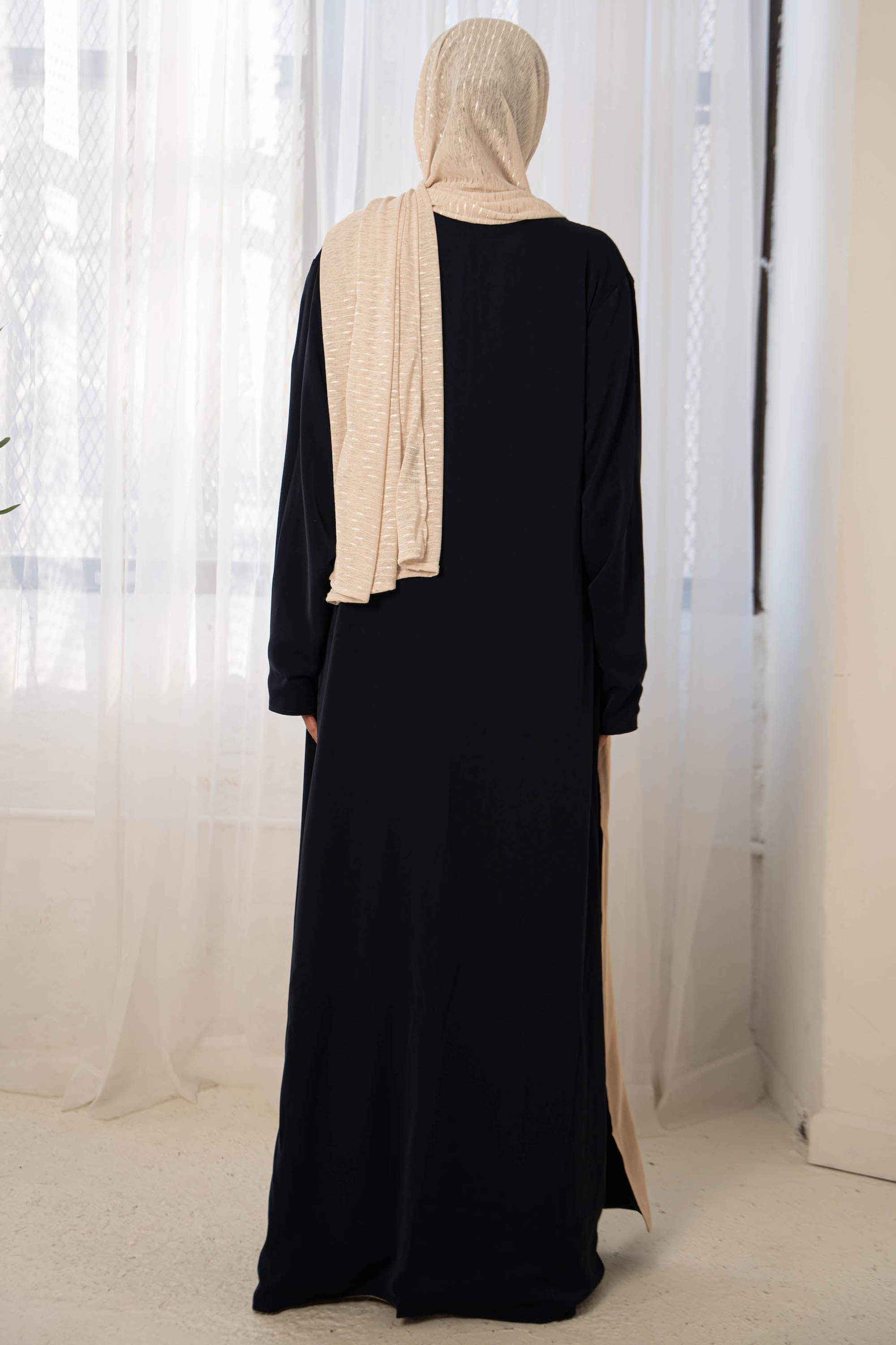 Black abaya with beige hijab in navy cream reversible open style