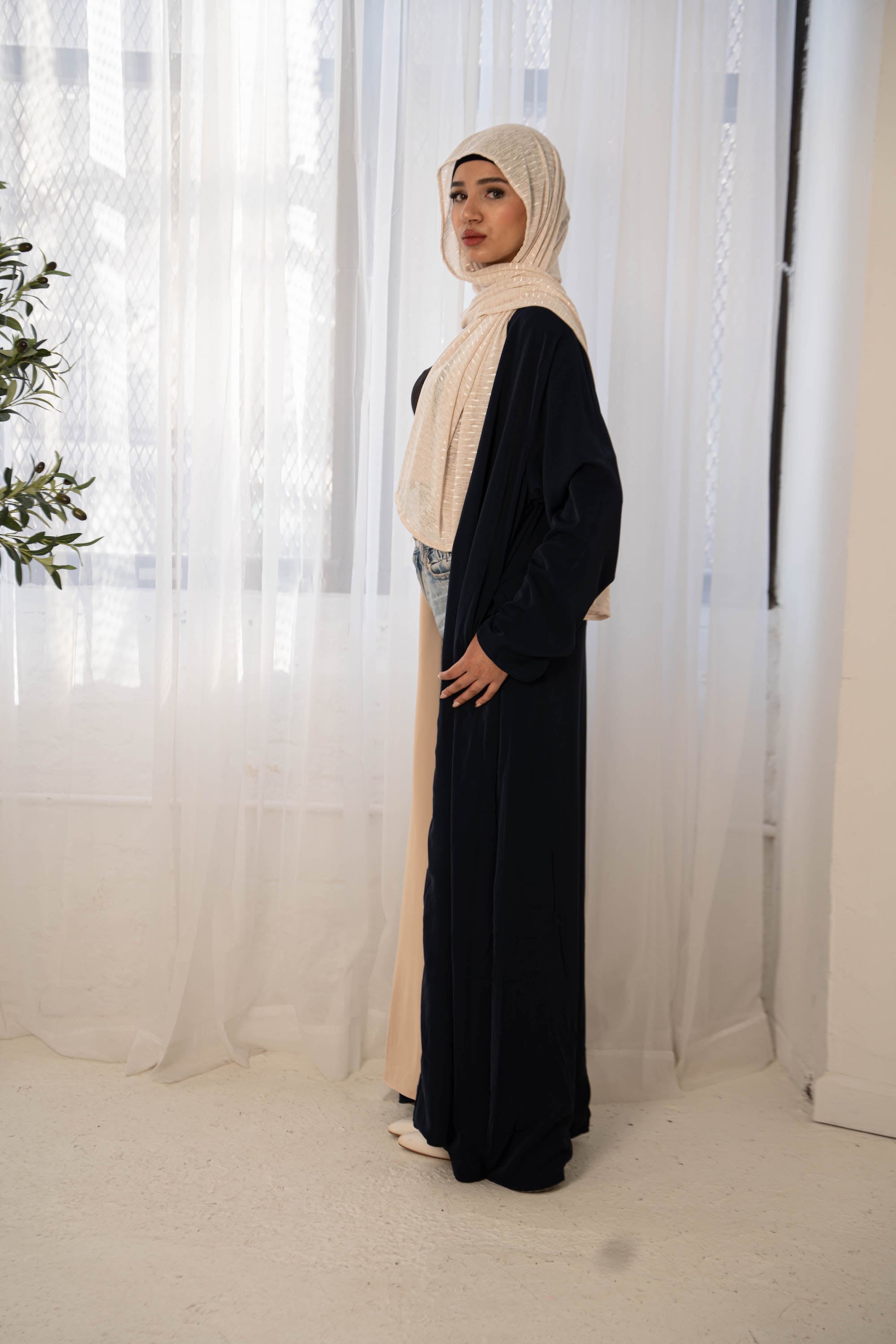 Woman in navy cream reversible open abaya and hijab