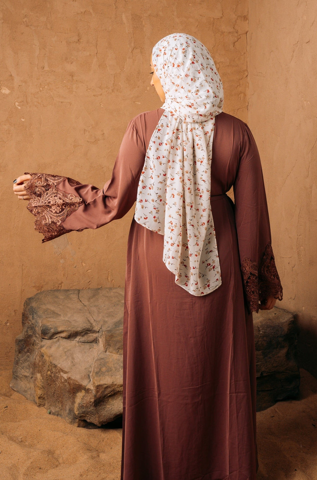 Woman in brown dress and floral hijab wearing purple lace sleeve abaya