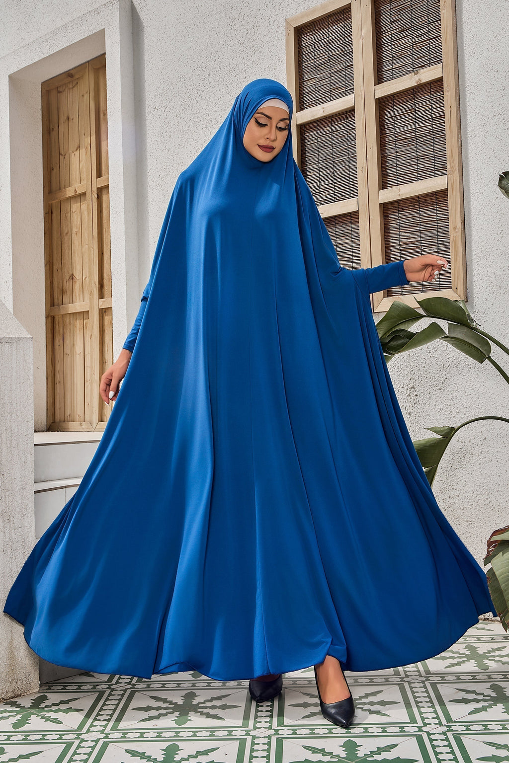 Teal long-sleeved modest dress with head covering for salah prayer